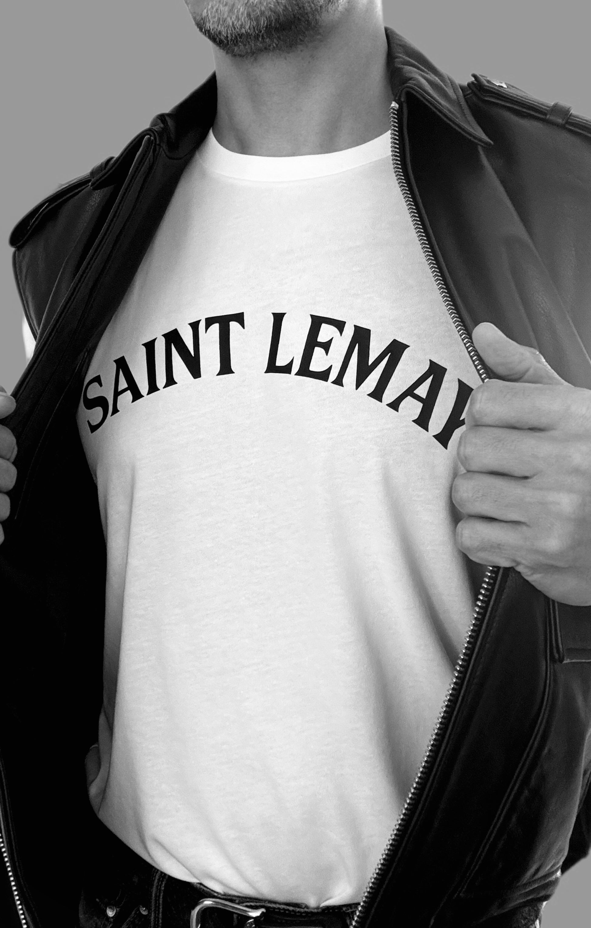 Person wearing a white t-shirt with 'SAINT LEMAY' text, partially zipped black leather jacket.